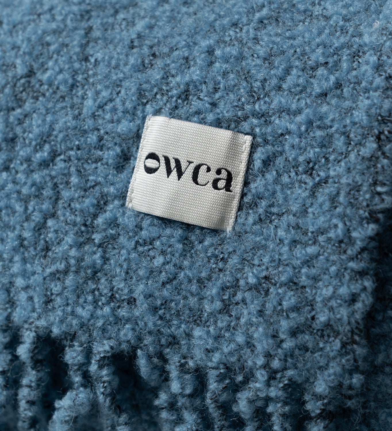 HELIOS Merino boucle blanket with fringe - blue